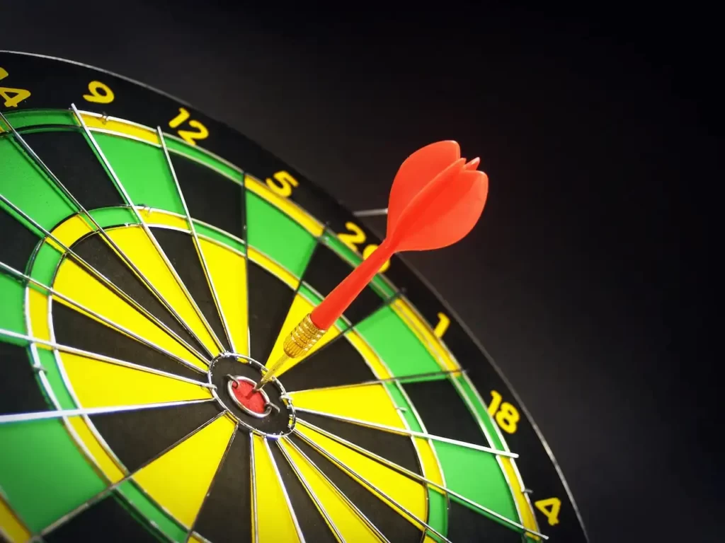 photo of a target with a dart in the center