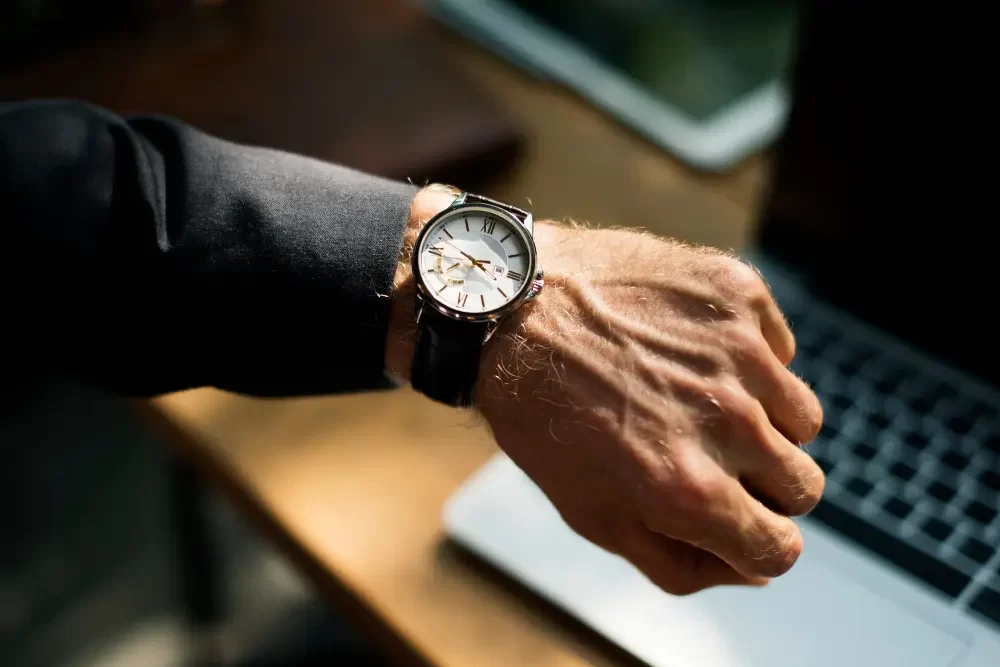 a man looking at his watch